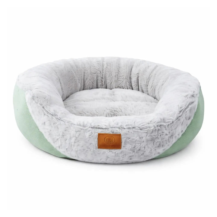Wonder Dog cama acolchada verde menta de borde alto con interior peludo blanco y etiqueta de cuero