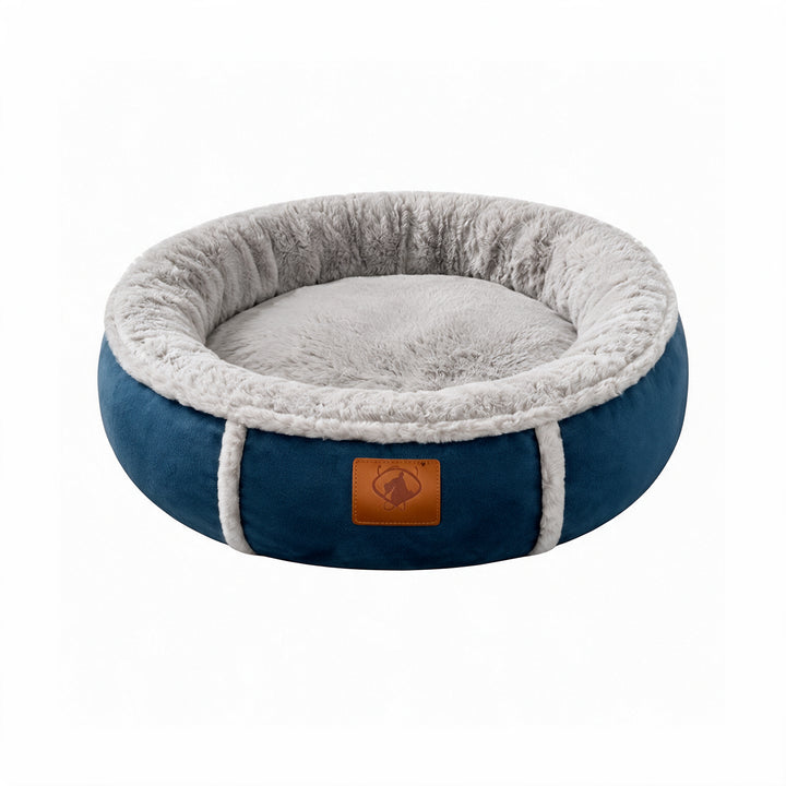 Wonder Dog cama circular azul petróleo de borde alto con interior peludo gris y etiqueta de cuero