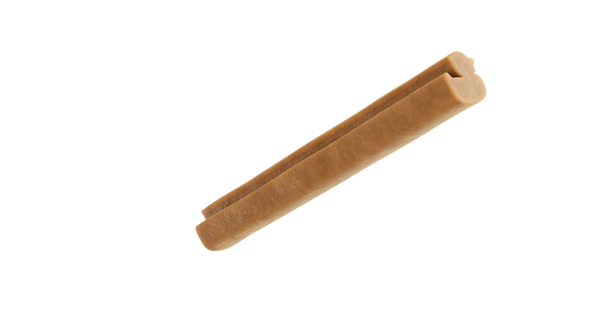 Snack dental Whimzees Puppy con forma de patito de goma, visto de lado